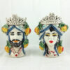 pair of Norman heads with fruit in caltagirone pottery,