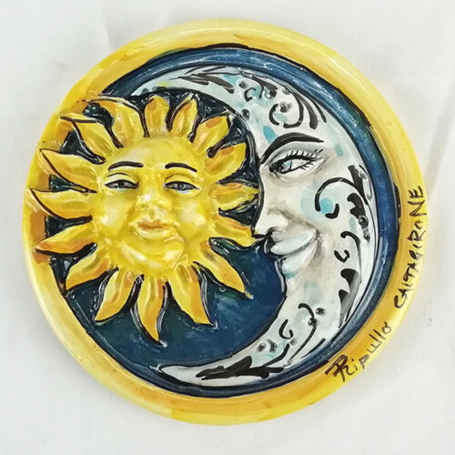 Ceramic sun and moon to decorate the home