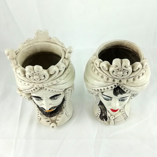 Pair of Norman heads in antiqued caltagirone pottery,
